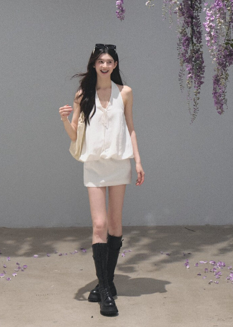 White open-back halter dress crafted from a lyocell-linen blend