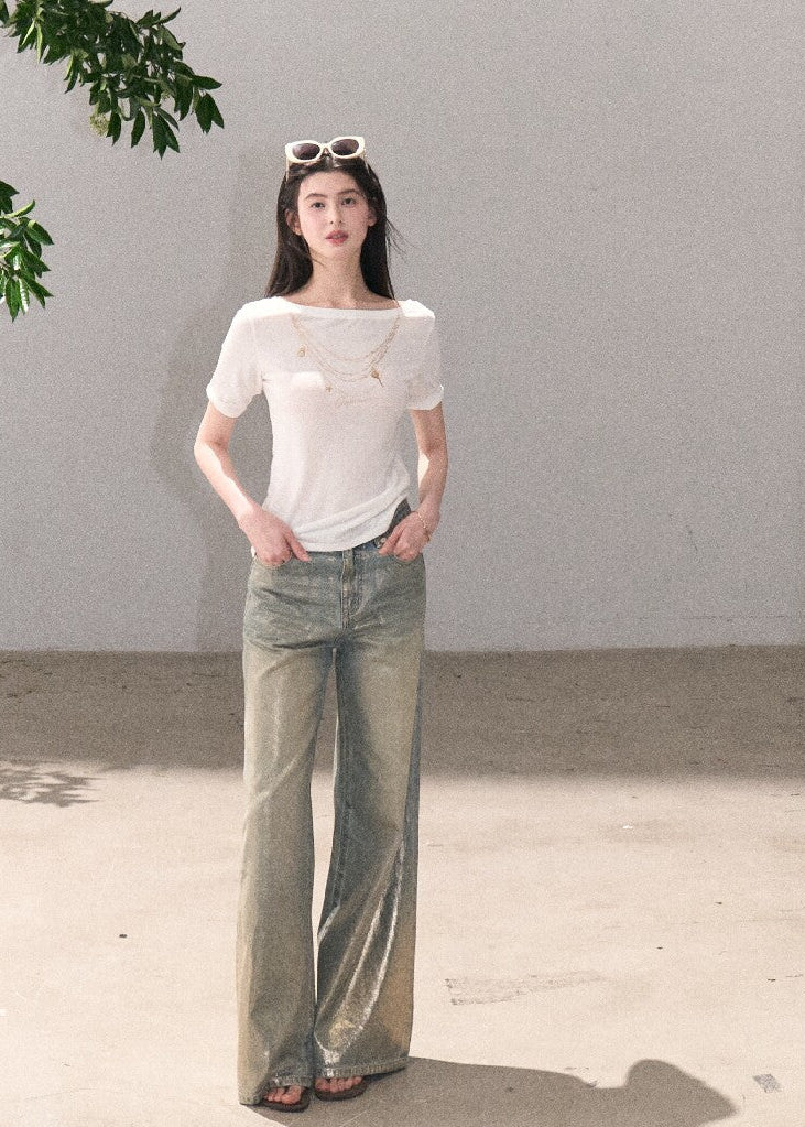 Gold foil wide-leg jeans styled with a cropped top