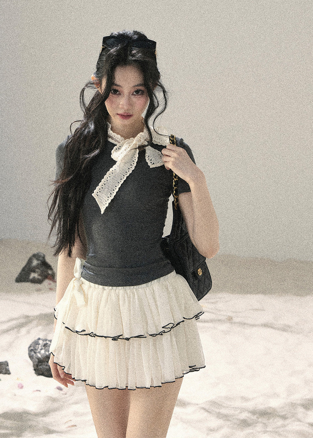 Gray fitted short-sleeve top with ivory lace bow neckline