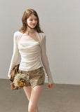 Romantic ivory long sleeve knit top with halter-inspired neckline