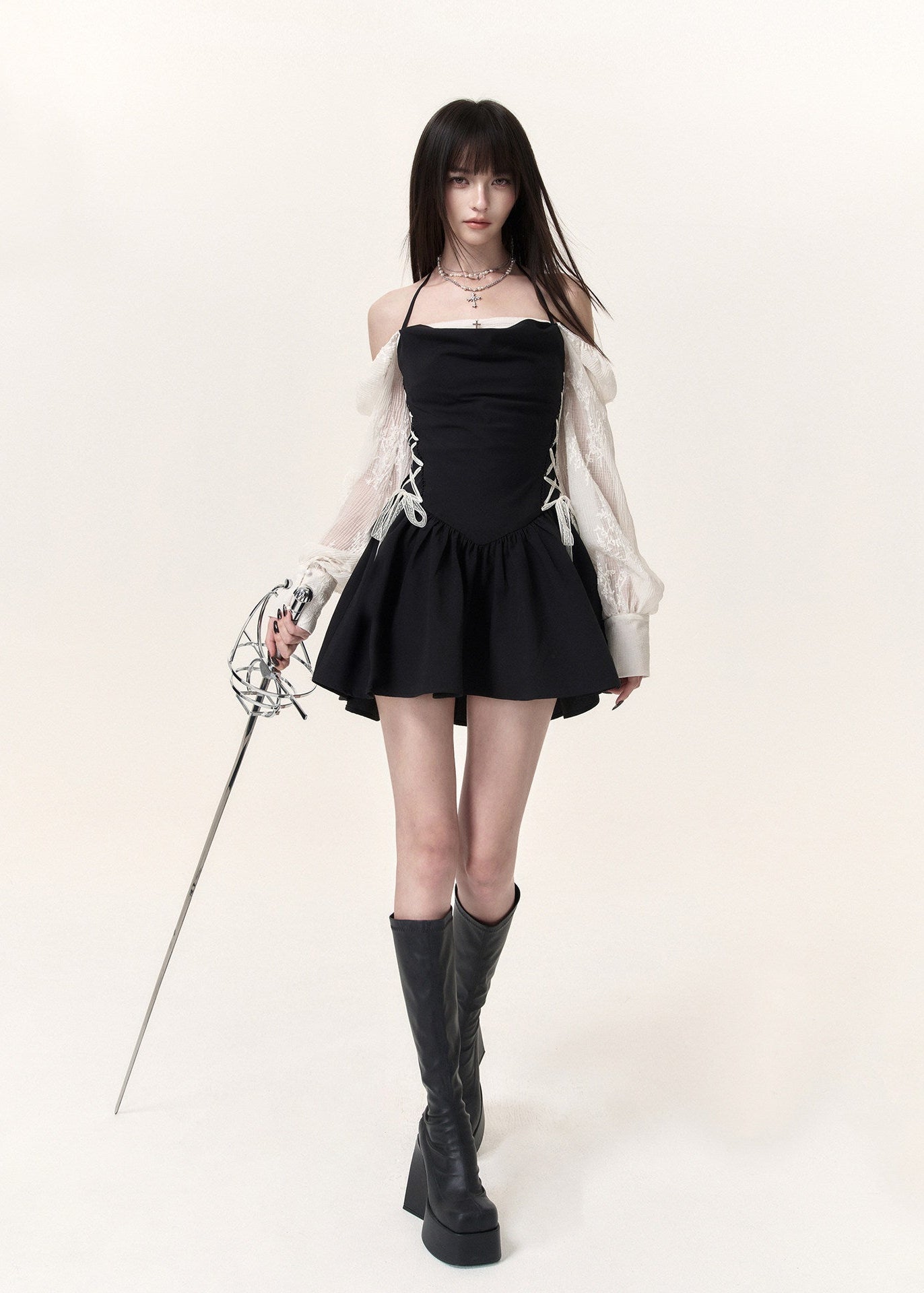 Black corset mini dress with ivory lace puff sleeves and flared skirt