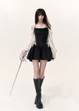 Black corset mini dress with ivory lace puff sleeves and flared skirt