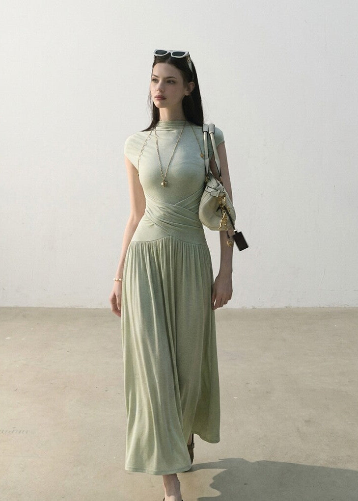 Cream slim-fit knit maxi dress with flowing skirt