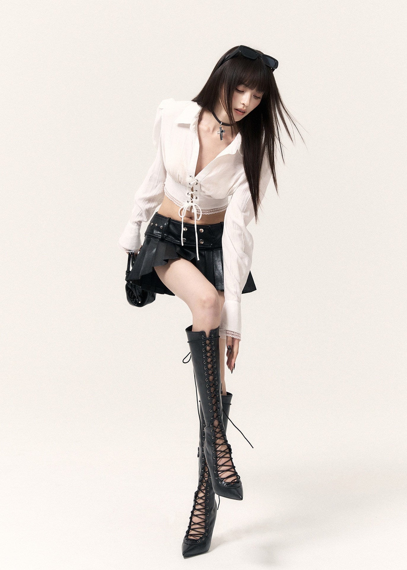 White corset-inspired shirt with long sleeves and an adjustable front tie