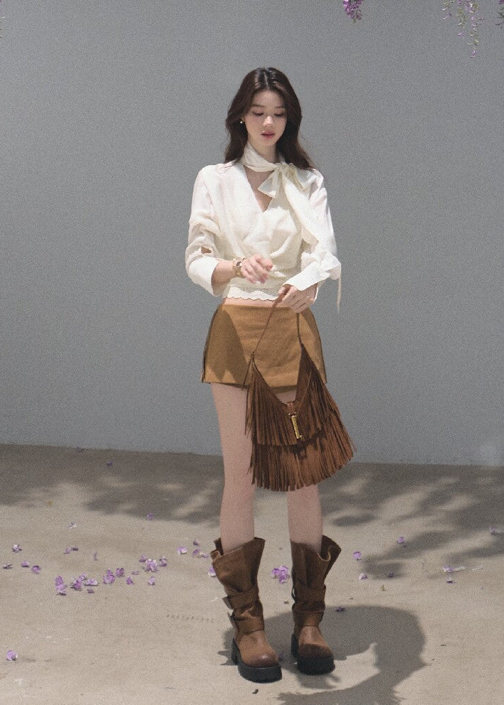 Ivory ribbon-tie cropped blouse with a softly gathered waist