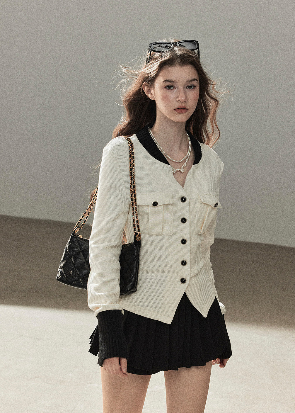 Women's textured V-neck cardigan and pleated mini skirt two-piece set