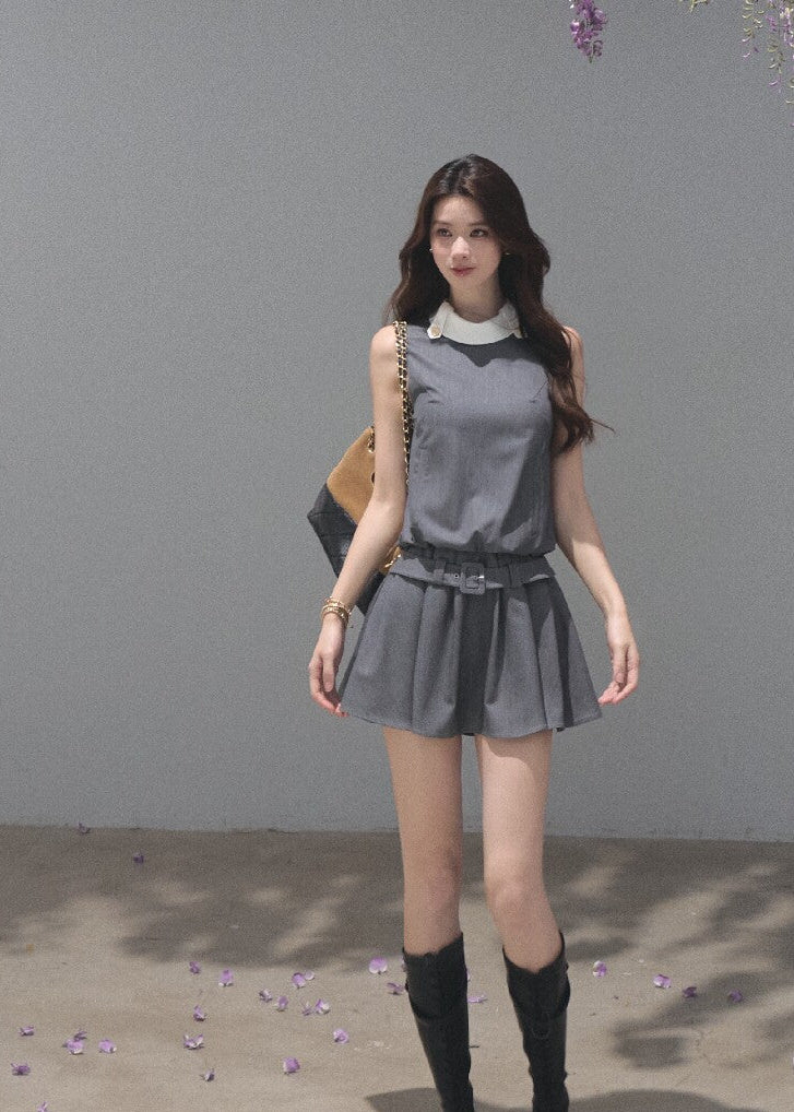 Sleeveless commuter-style dress with a white collar and gold-tone buttons
