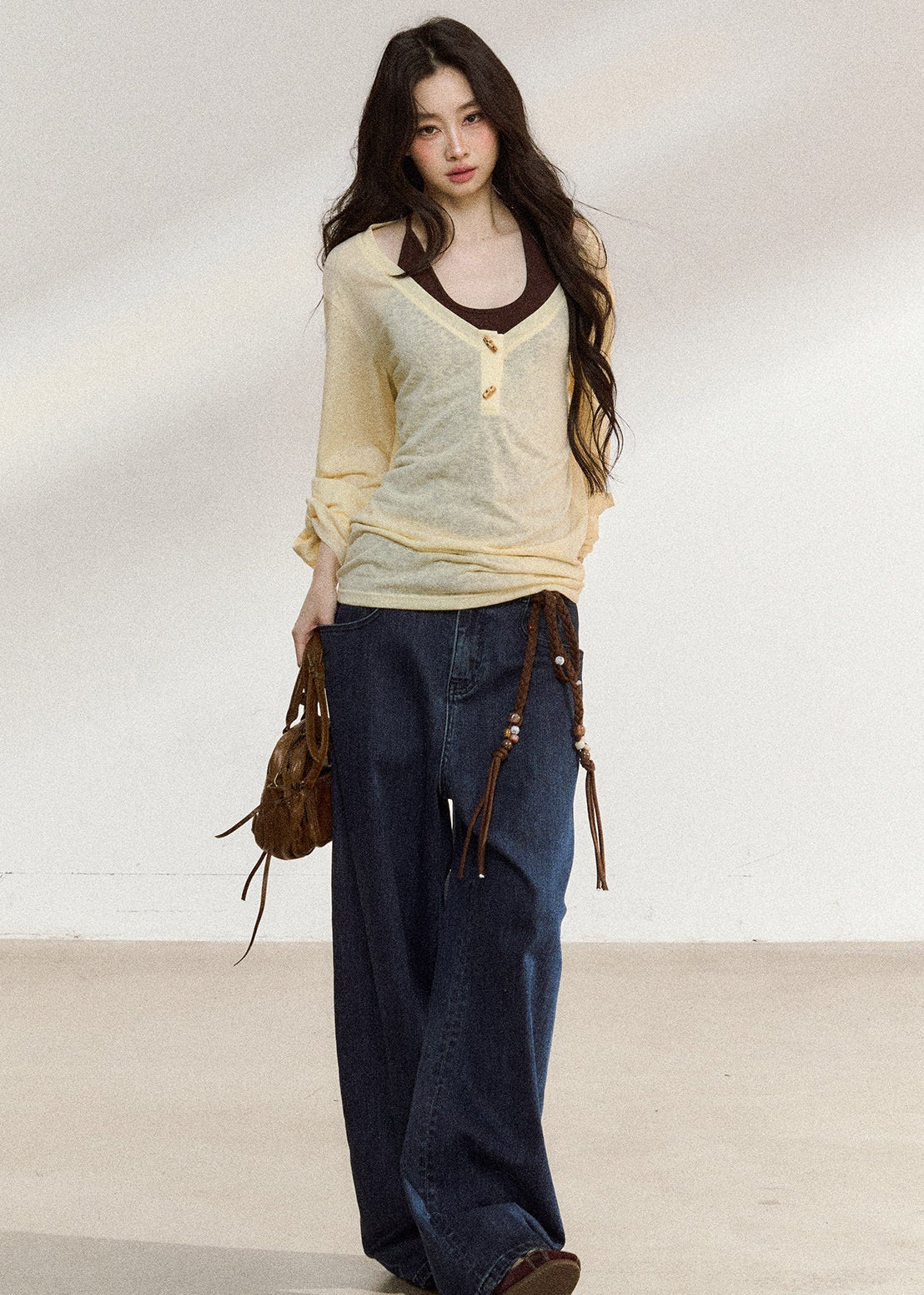 Pale yellow wooden-button cover-up with a brown camisole