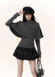 Women's black check-pattern mini skort with decorative button accents