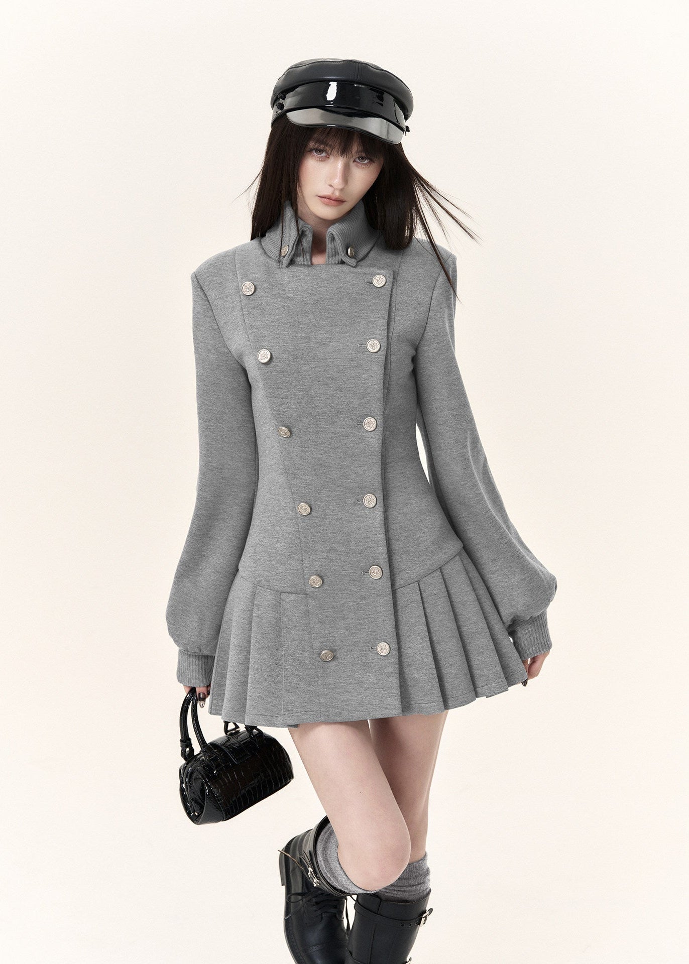 Women's grey tailored double-button dress with fitted waist and long sleeves