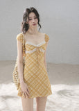 French-inspired yellow dress with a lace-trimmed neckline