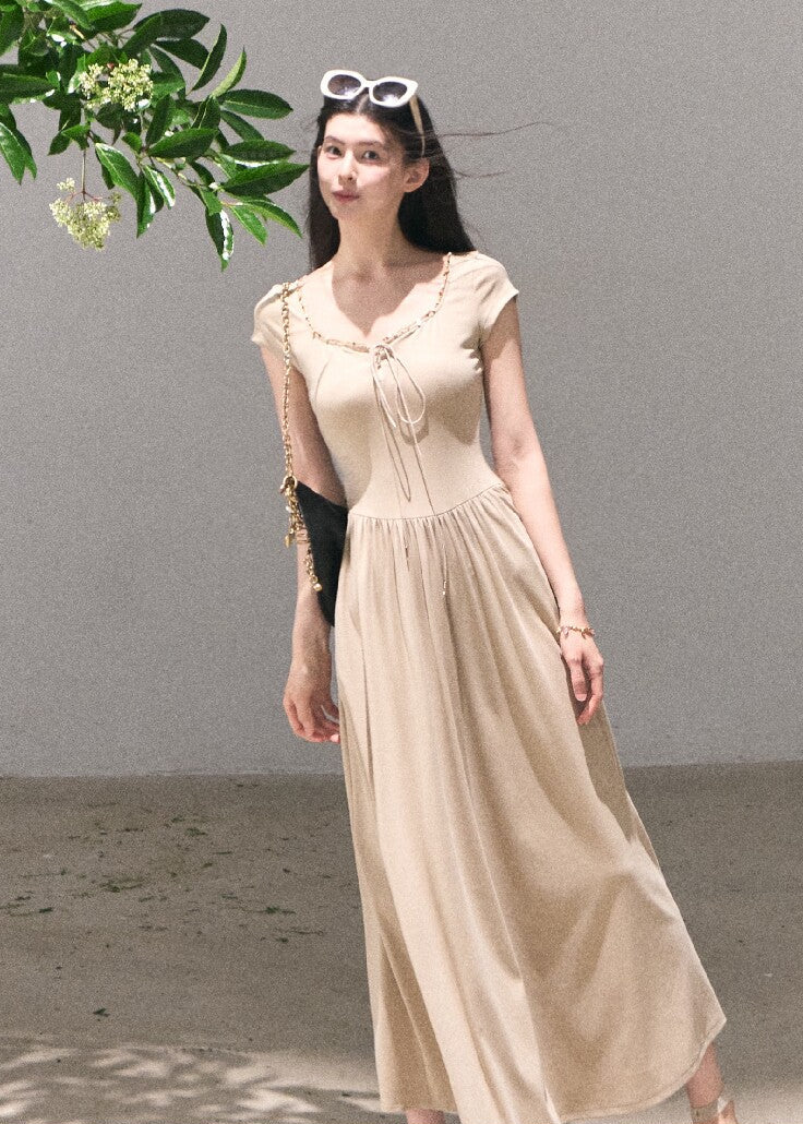 Soft beige maxi dress styled with sandals