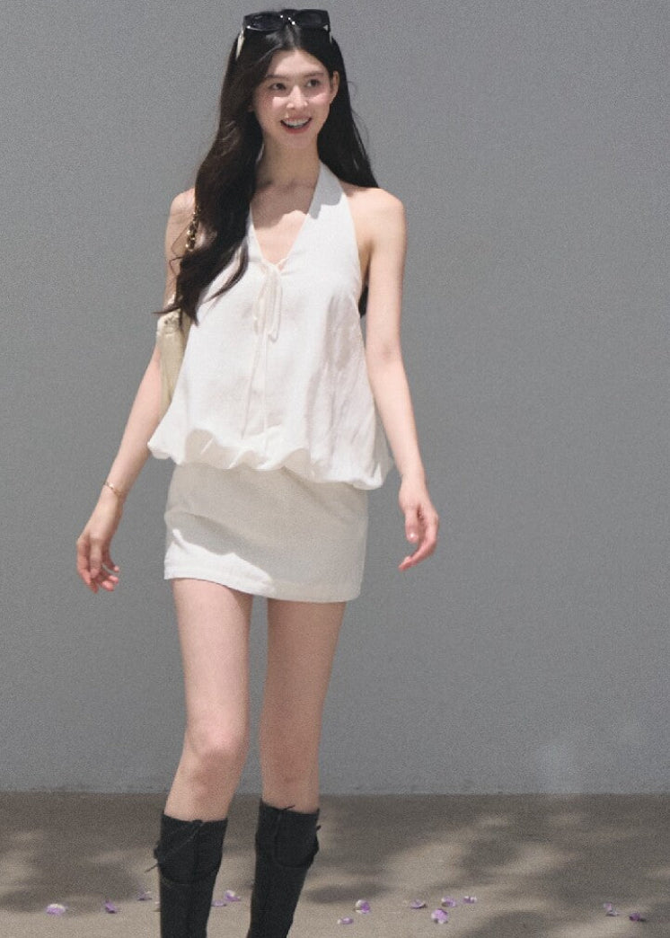 White open-back halter dress crafted from a lyocell-linen blend