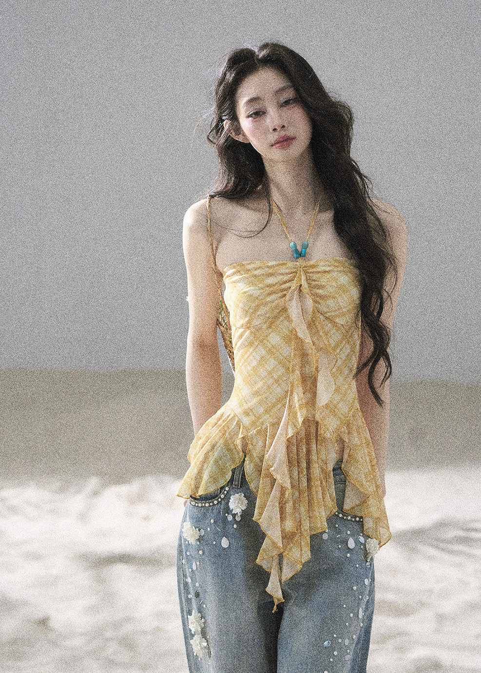 Ruched yellow check top with an asymmetric flared silhouette