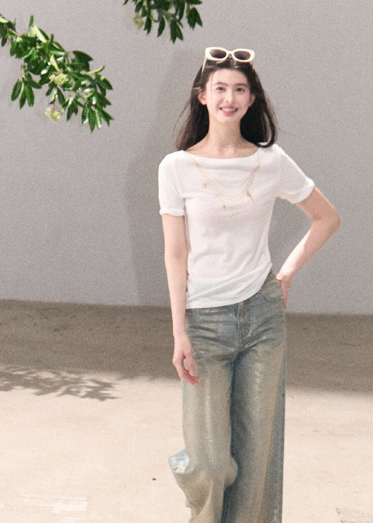 Light blue cotton jeans with shimmering surface detail