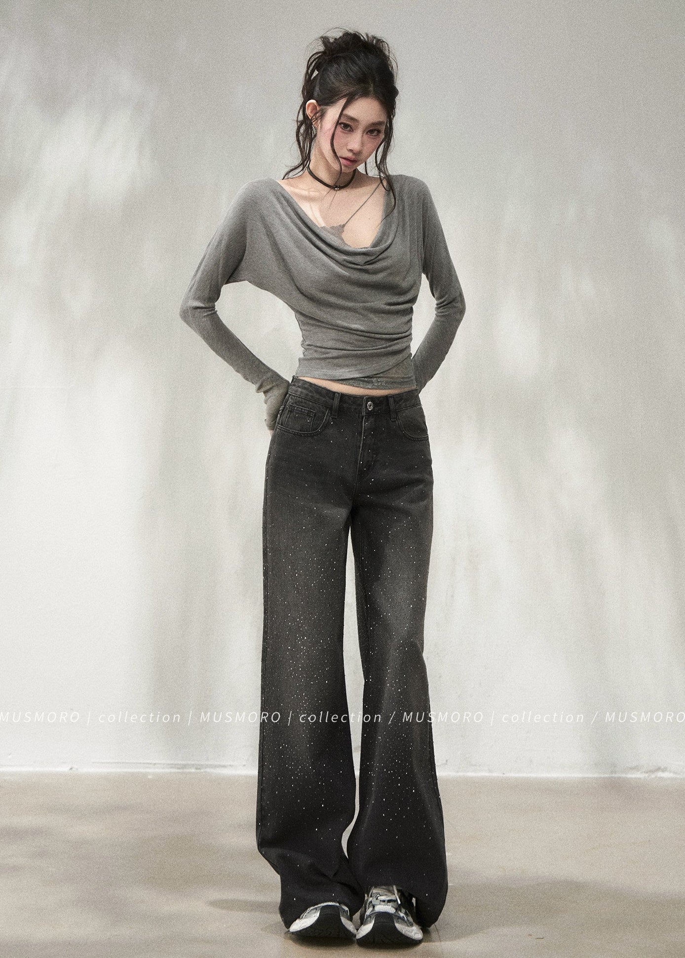 Elegant draped neck top styled with black wide-leg denim jeans