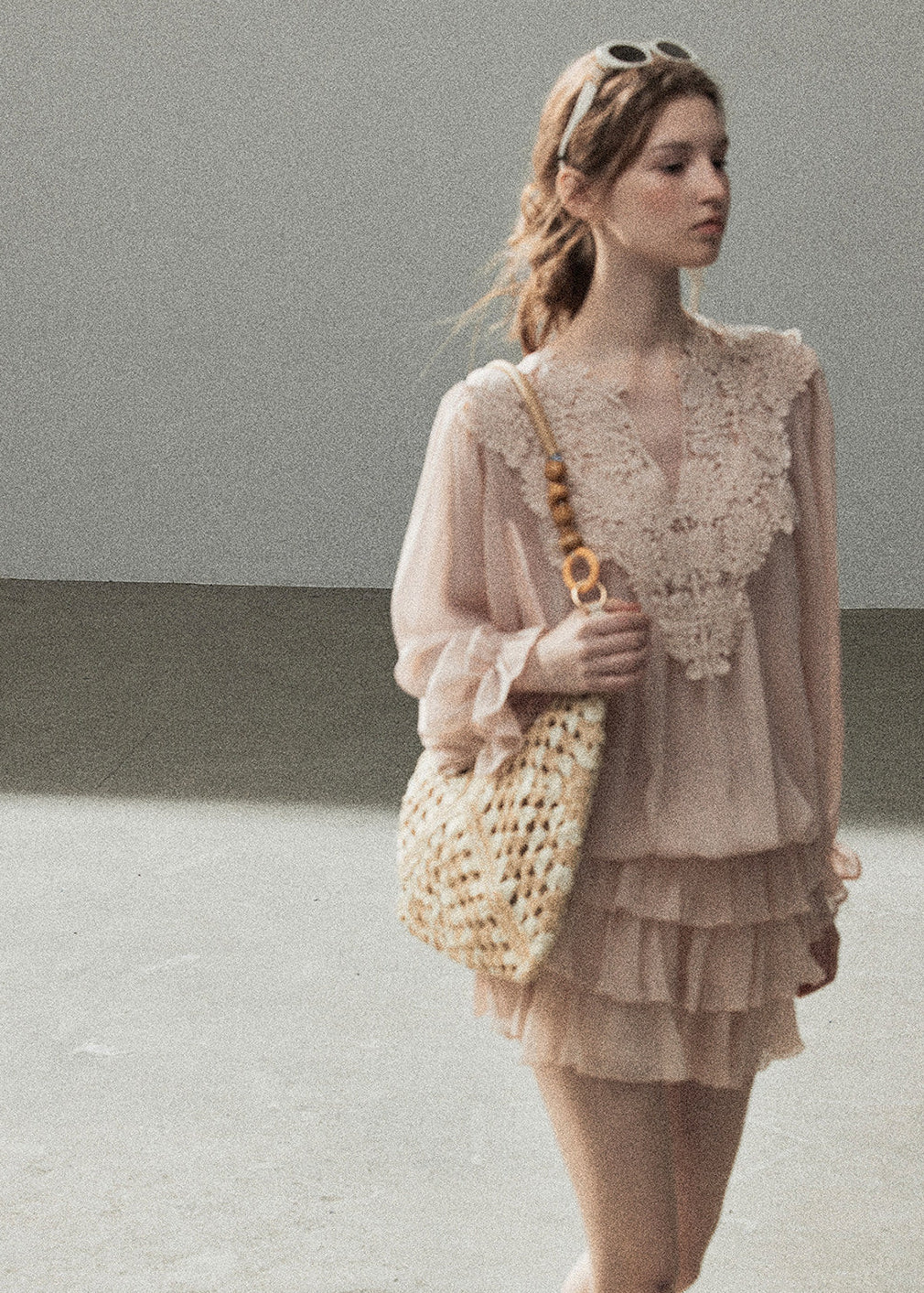 Pink V-neck lace blouse with long flowing sleeves