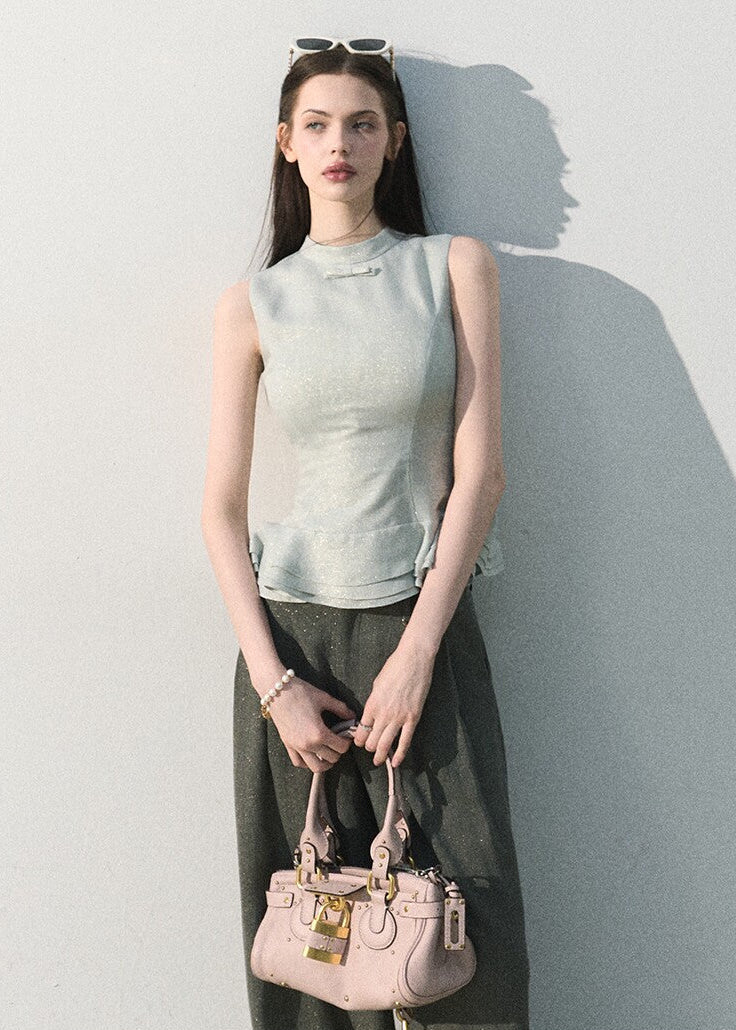 Light blue waist-cinching sleeveless blouse