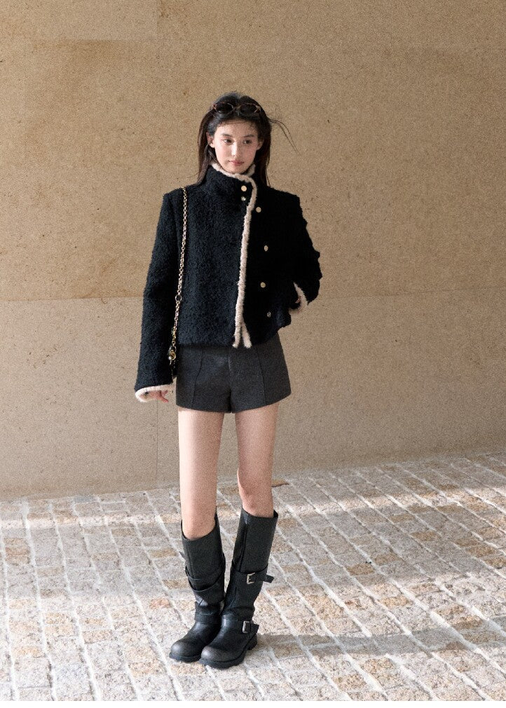 Black wool blend jacket with contrasting cream trim and gold buttons