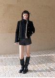 Black wool blend jacket with contrasting cream trim and gold buttons