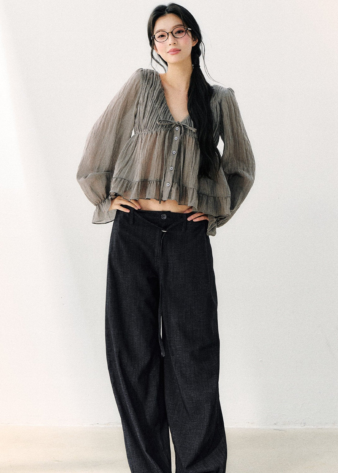 Women’s semi-sheer gray blouse with flared ruffle cuffs