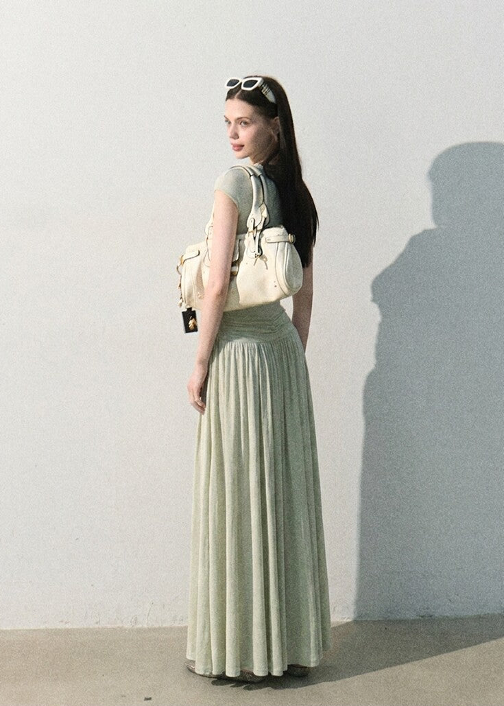 Sage green fitted bodice dress with full-length skirt