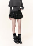 Black plaid pleated mini skort with subtle sparkle detailing