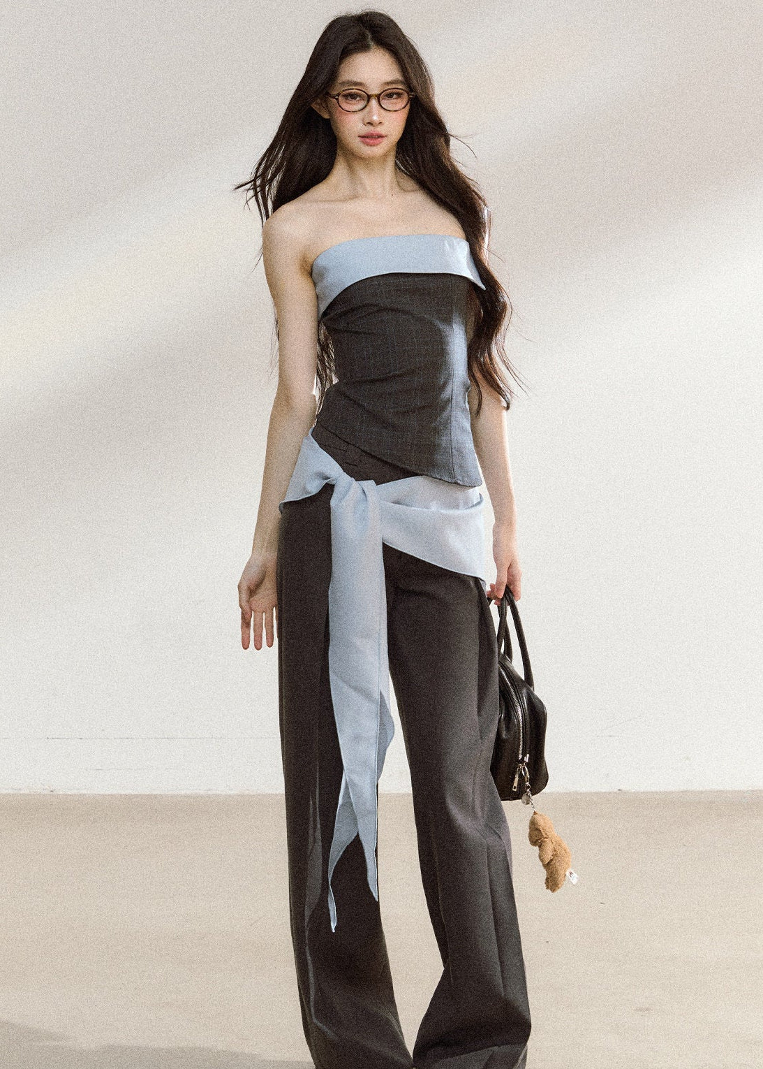 Dark gray relaxed wide-leg trousers with a tailored waistband