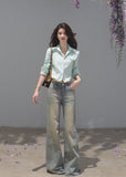 Vintage distressed denim jeans with a subtle flared silhouette