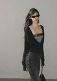 Black waist-fit draped top with gray inner layer