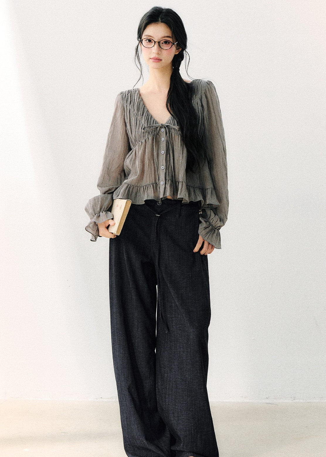 Women’s semi-sheer gray blouse with flared ruffle cuffs