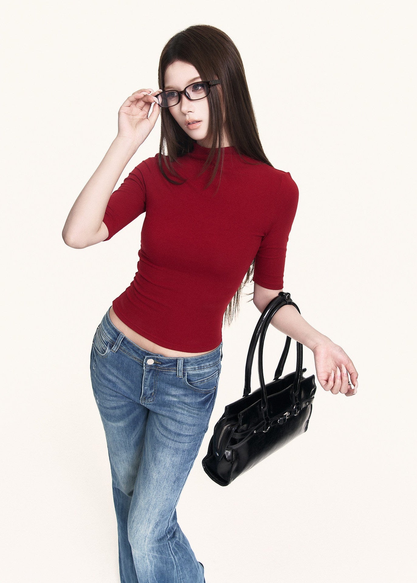 Slim red top styled with blue flare jeans