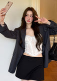 Charcoal gray oversized blazer with notched lapels and a two-button front