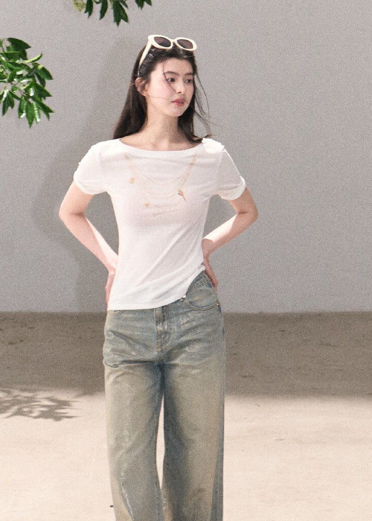 Light blue cotton jeans with shimmering surface detail