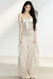 Beige high-waisted wide-leg trousers with side pleats
