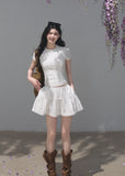 White cotton short-sleeve top and tiered mini skirt two-piece set