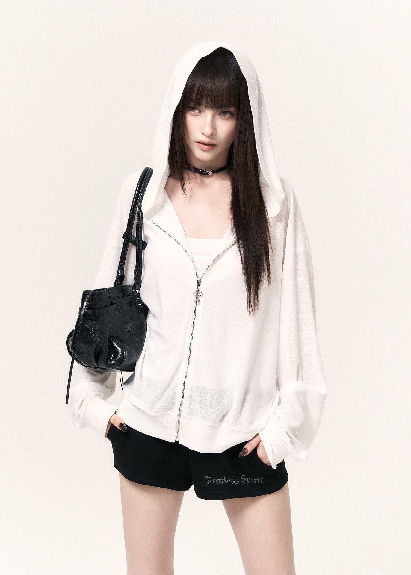 Black casual shorts with a drawstring waist, cross pendants, and lettering print
