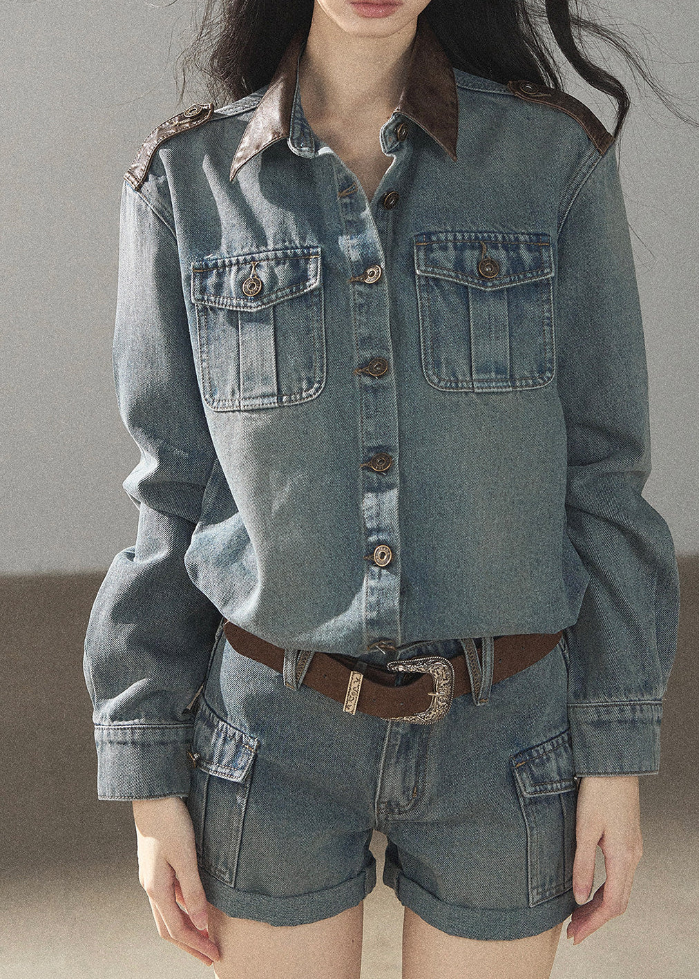 Model wearing washed denim jacket and shorts