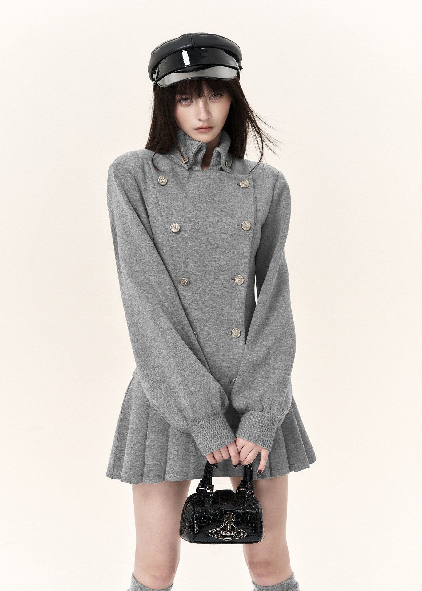 Women's grey tailored double-button dress with fitted waist and long sleeves