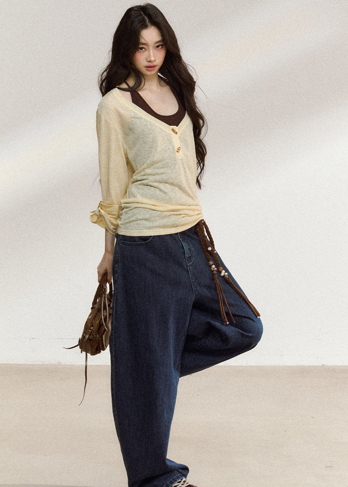 Pale yellow wooden-button cover-up with a brown camisole