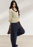 Pale yellow wooden-button cover-up with a brown camisole
