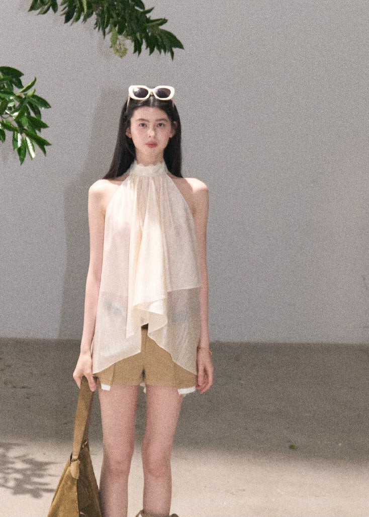 Feminine sleeveless top with airy draped fabric