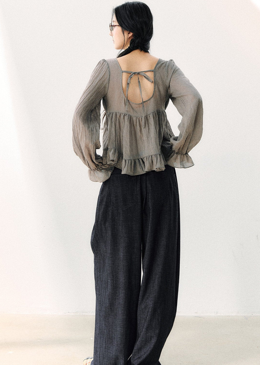 Women’s semi-sheer gray blouse with flared ruffle cuffs
