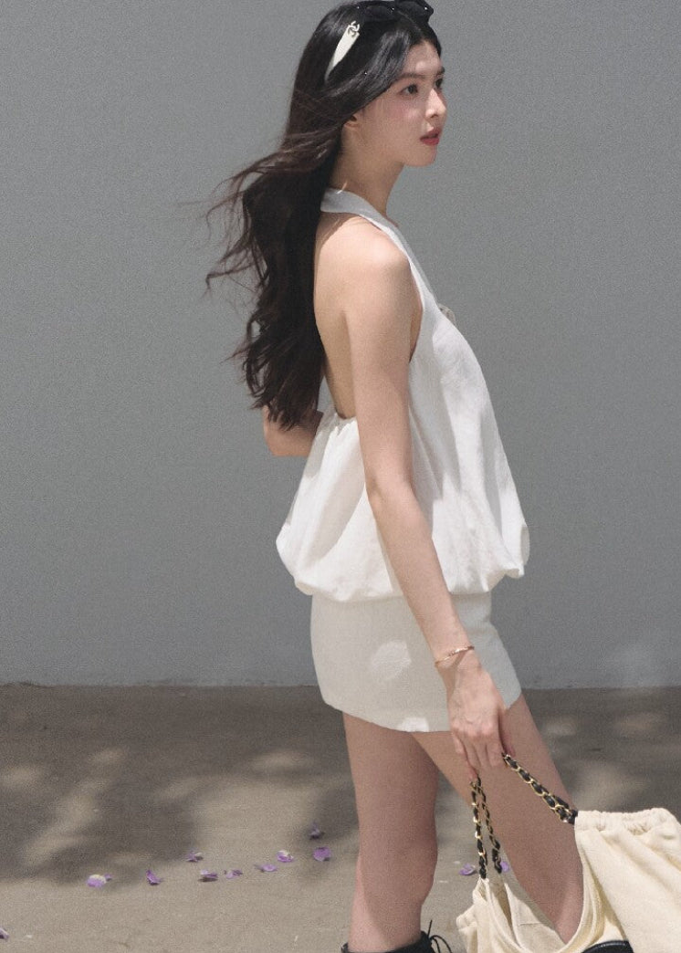 White open-back halter dress crafted from a lyocell-linen blend