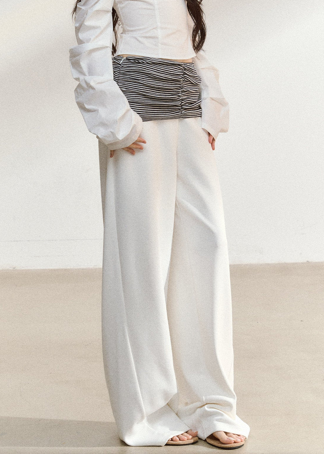White wide-leg trousers with a ruched striped waistband