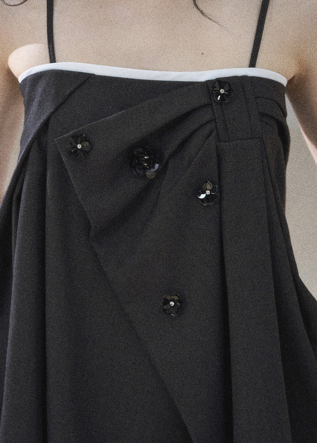 Feminine black two-piece outfit with subtle crystal accents
