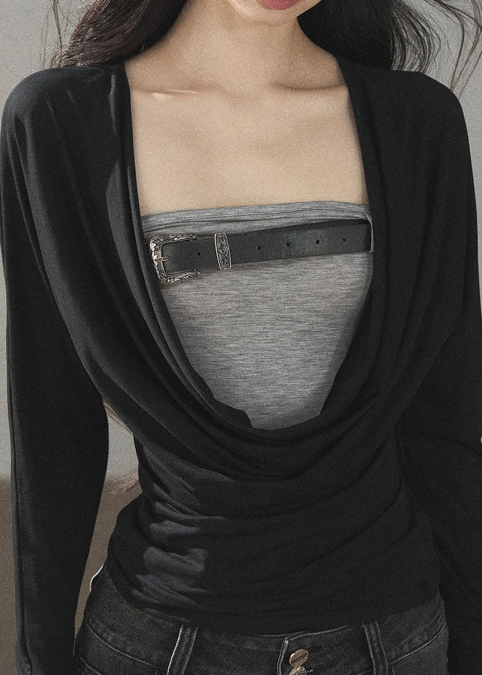 Black waist-fit draped top with gray inner layer