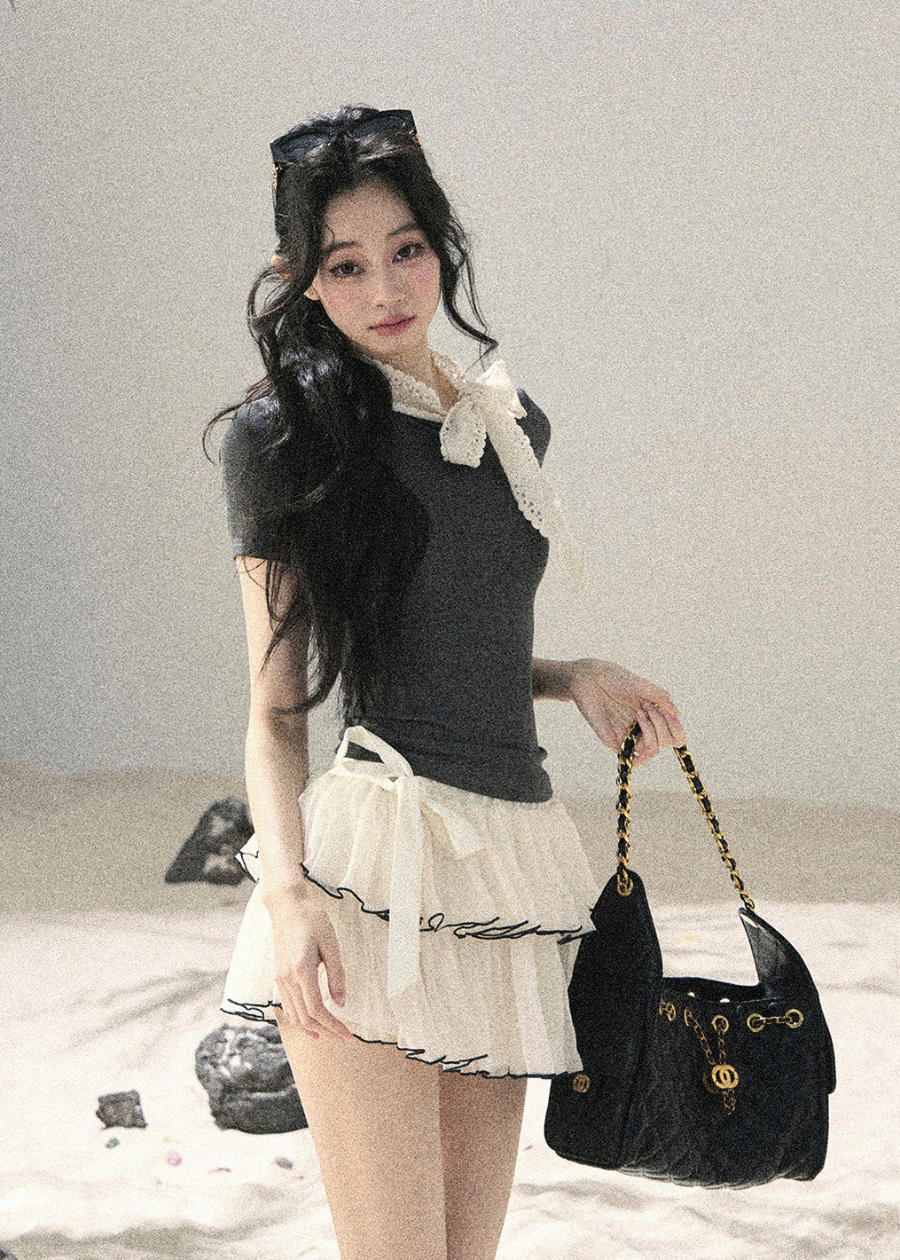 Gray fitted short-sleeve top with ivory lace bow neckline