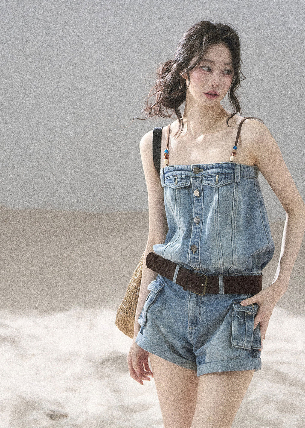 Vintage-inspired denim romper with pocket details