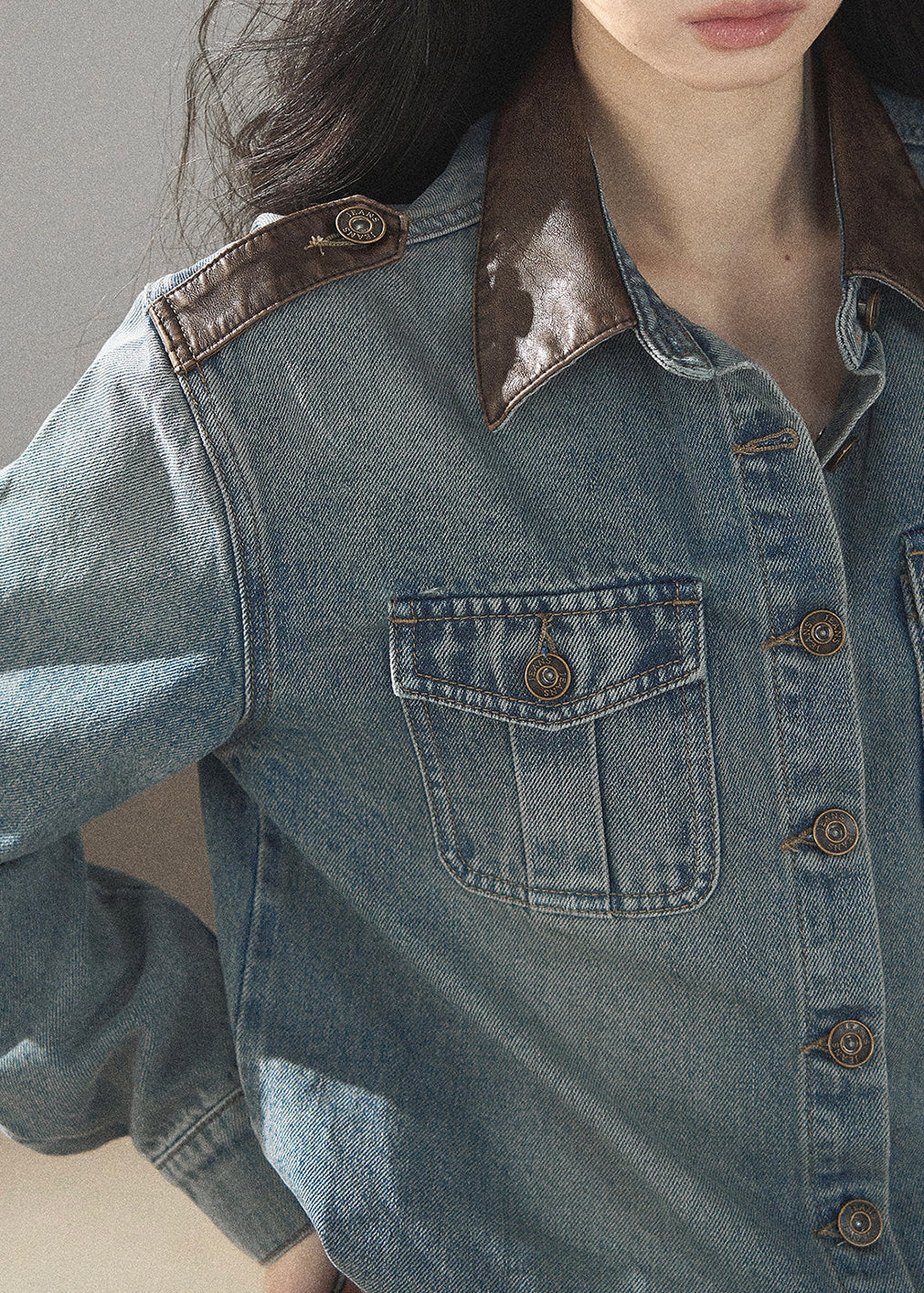 Model wearing washed denim jacket and shorts
